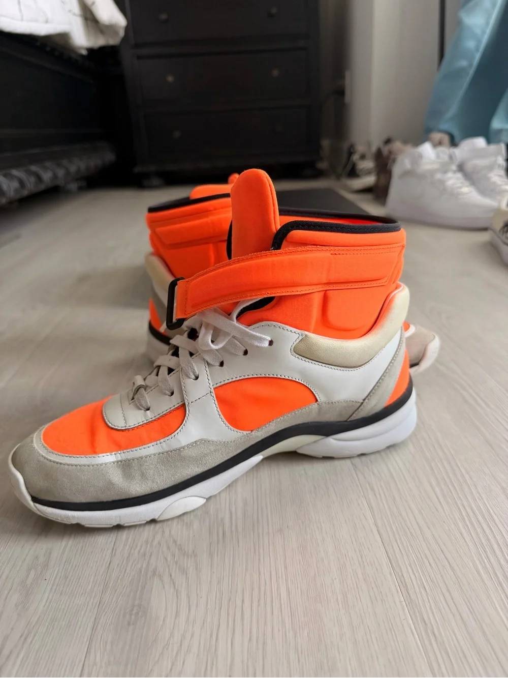 CHANEL Orange and Black High-Top Sneaker